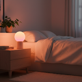 LED Sunset Lamp casting warm orange and pink gradient light in a cozy bedroom
