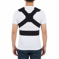 Black posture corrector worn over white t-shirt, person standing tall with good posture